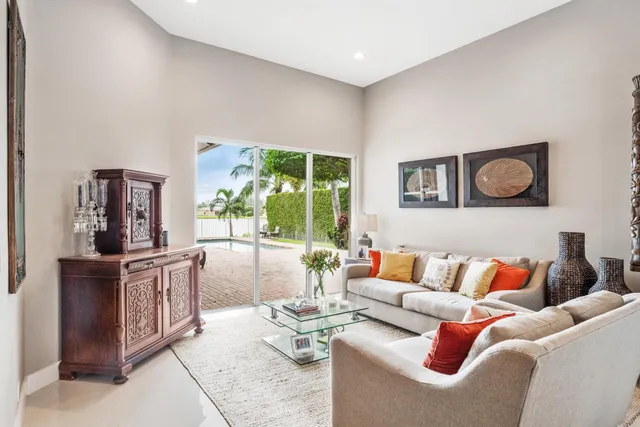 a living room with furniture fireplace and a flat screen tv