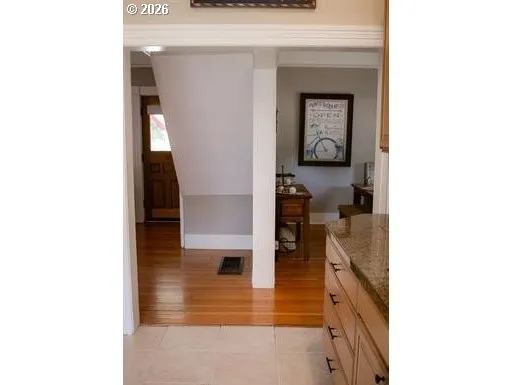 a view of living room with furniture and wooden floor
