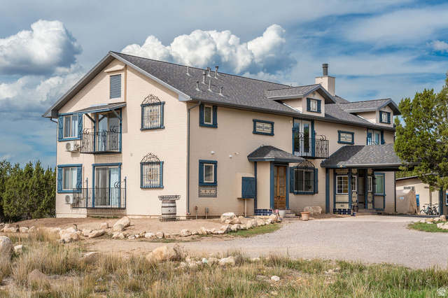 11550 Pigeon Hollow Road Spring City, UT 84662 - Photo 17 of 85 Multi-level stucco exterior with a dormered roofline