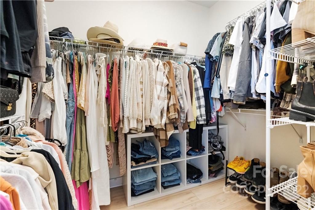 8106 Evanston Falls Road Huntersville, NC 28078 - Photo 22 of 36 a view of walk in closet with clothes and shoes