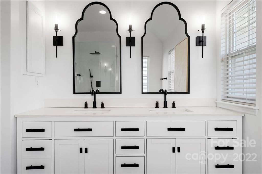8106 Evanston Falls Road Huntersville, NC 28078 - Photo 26 of 36 a bathroom with a double vanity sink and two mirror
