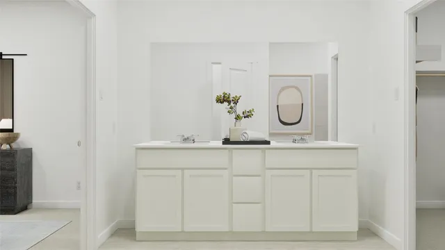 a bathroom with mirror and