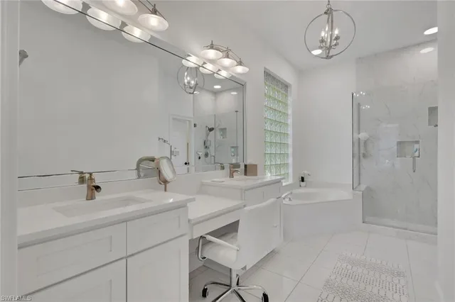 a bathroom with a shower sink and mirror