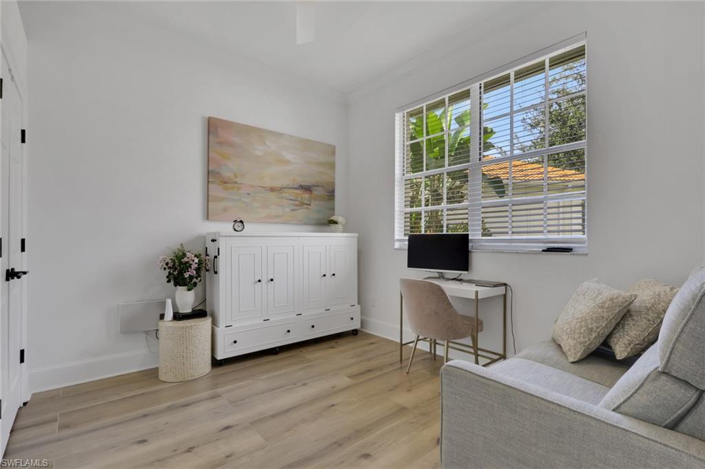 136 April Sound Drive Naples, FL 34119 - Photo 13 of 24 a living room with furniture and a window