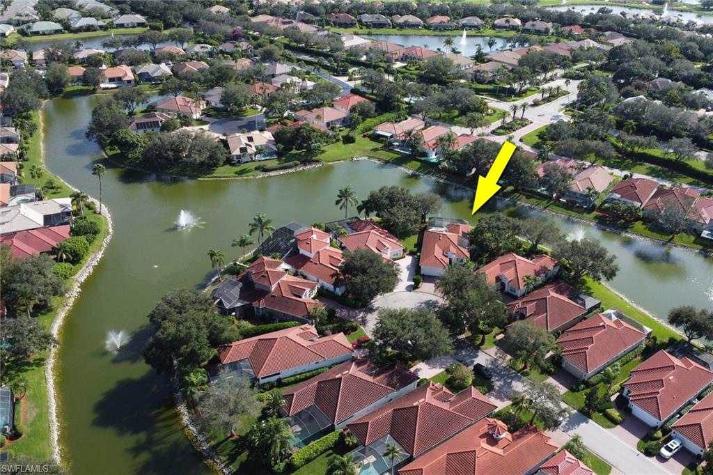 136 April Sound Drive Naples, FL 34119 - Photo 23 of 24 an aerial view of lake residential houses with outdoor space and lake view