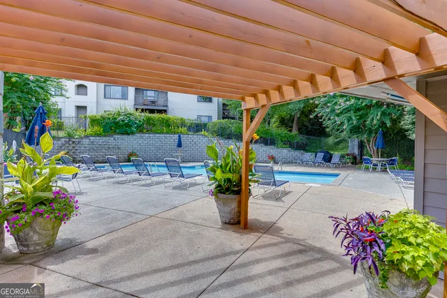 a view of a fountain with potted plants