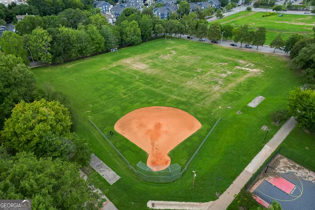 a view of a patio with table and chairs and potted plants