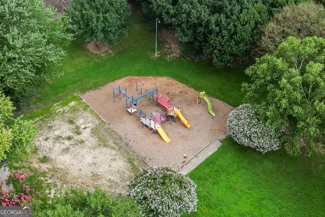 a sign that is in front of flowers