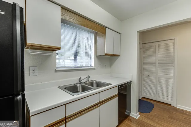 a kitchen with a sink and cabinets