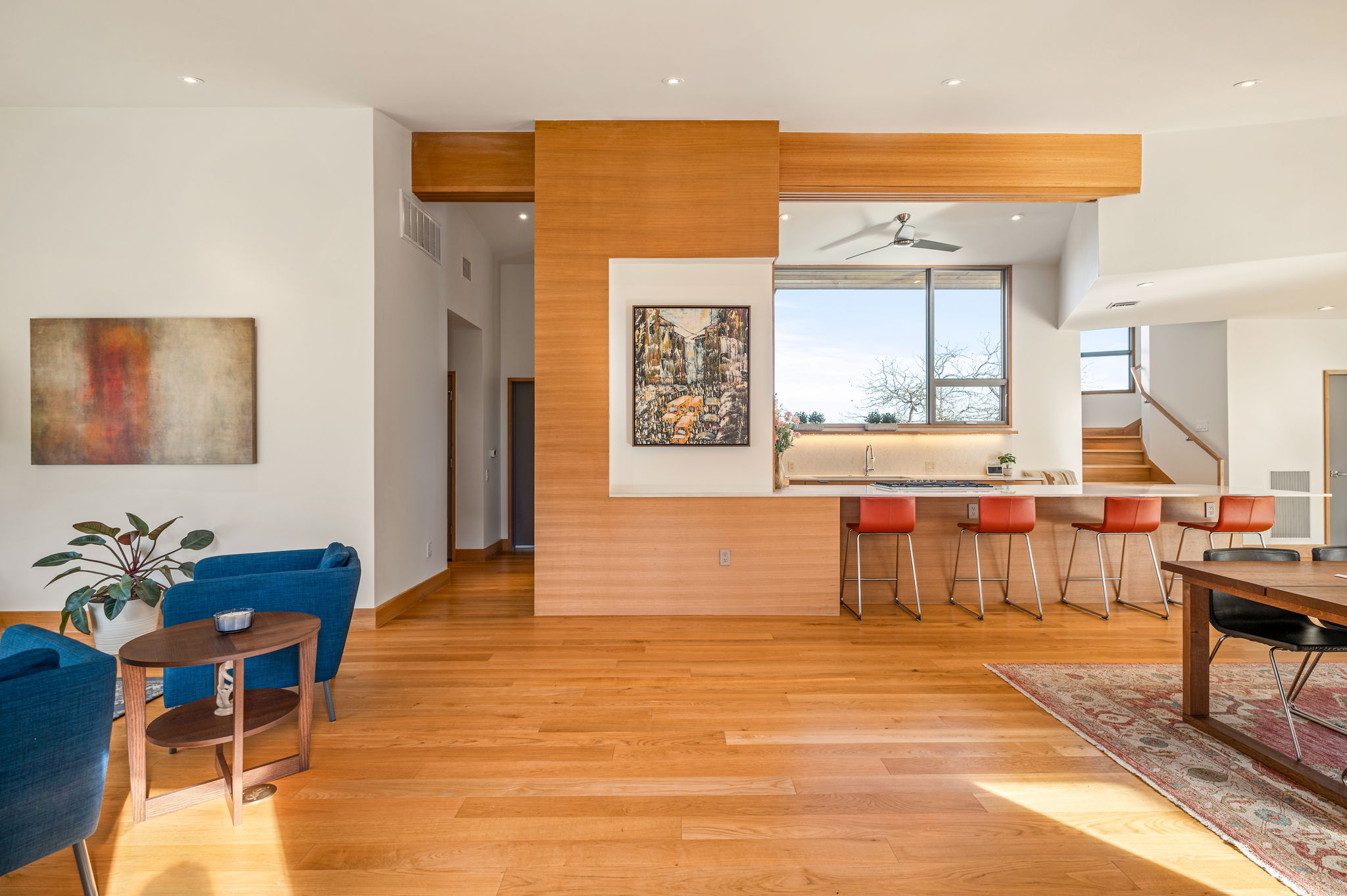 a living room with furniture a dining table and a piano table