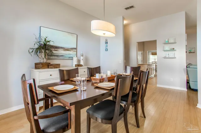 a dining room with furniture and window