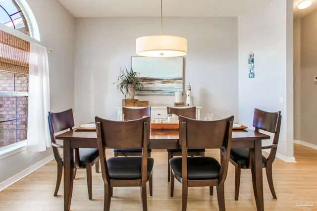 a kitchen with cabinets and window