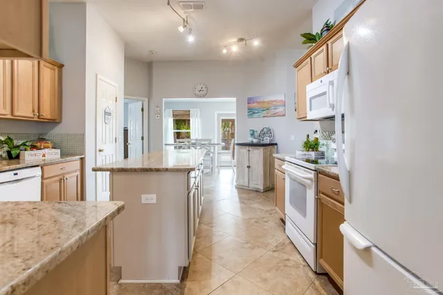 a dining room with furniture and a window
