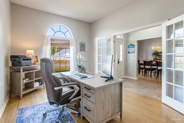 a workspace with furniture and wooden floor