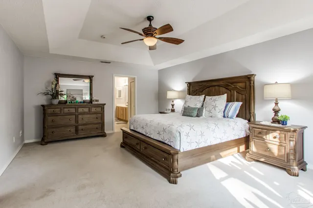 a spacious bathroom with a sink double vanity and a mirror