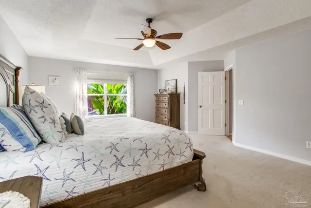 a en suite bathroom with a double vanity sink and a mirror