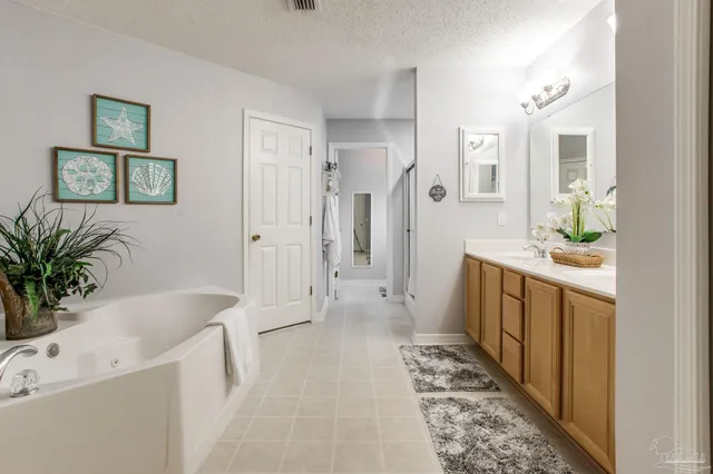 a white bath tub sitting in a bathroom