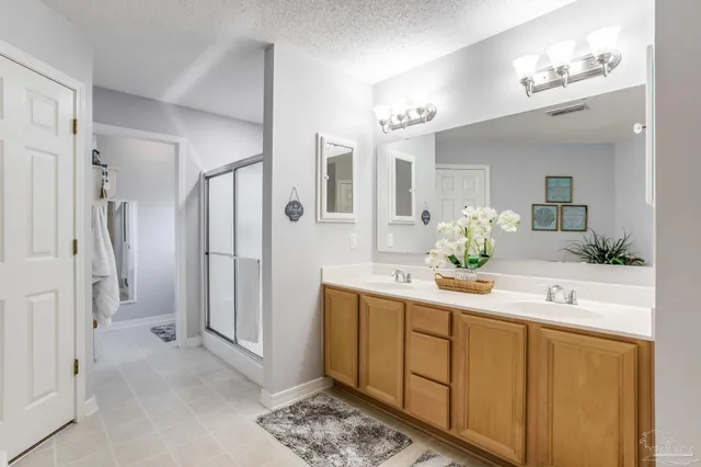 a white toilet next to a bathroom sink