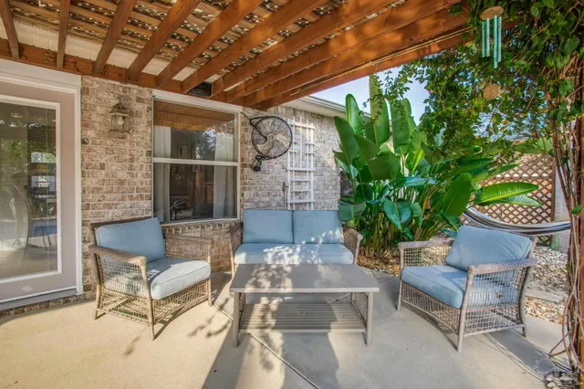 a view of a swimming pool with a patio