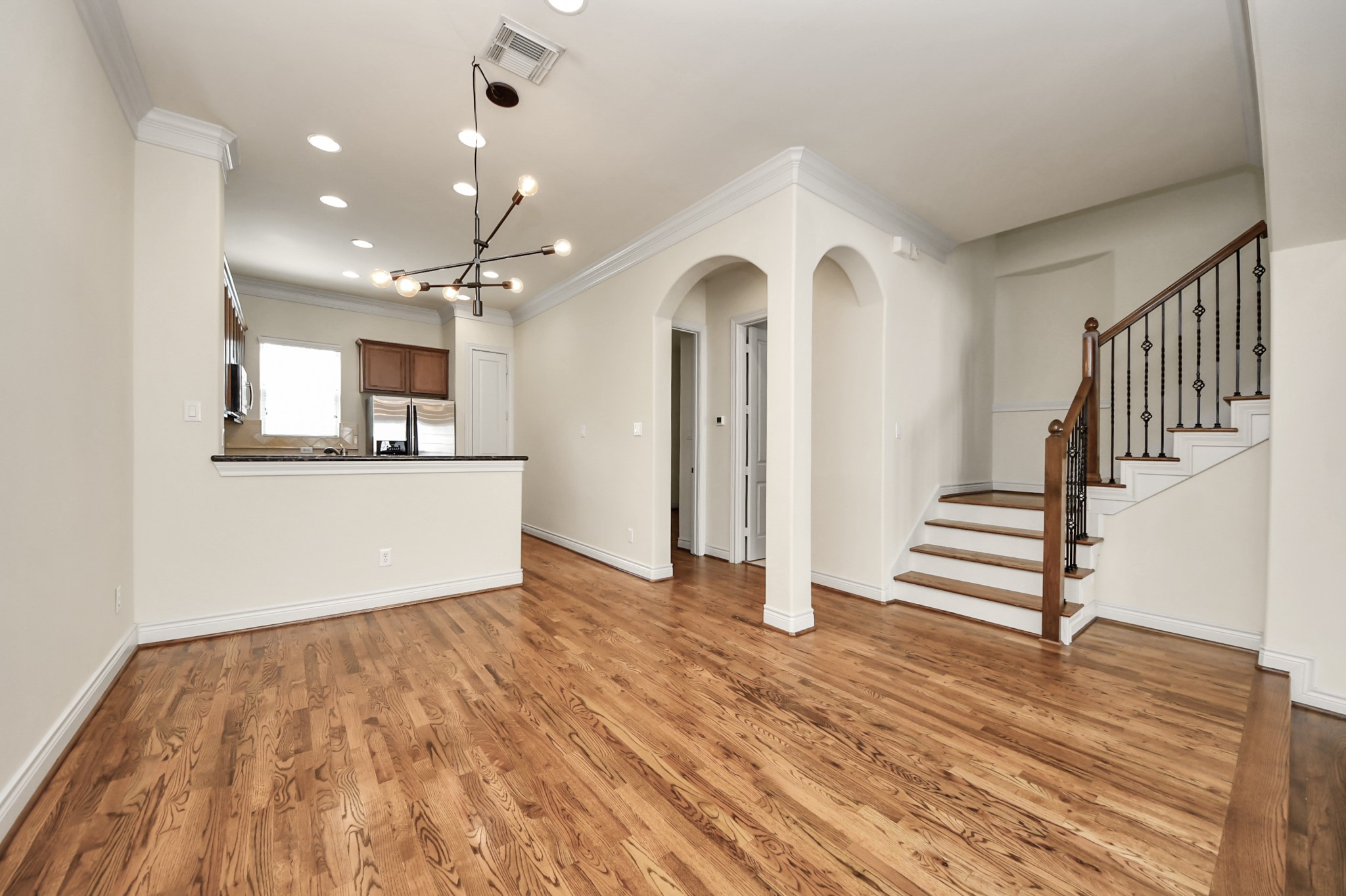 3422 Center Street Houston, TX 77007 - Photo 6 of 27 Dining with updated light fixture. Note the gorgeous wood tread stairs with wrought iron railings.