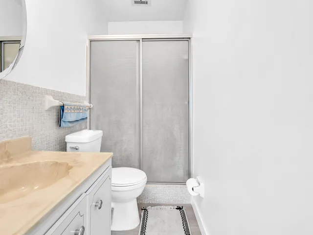 a front view of a house with a yard and a garage