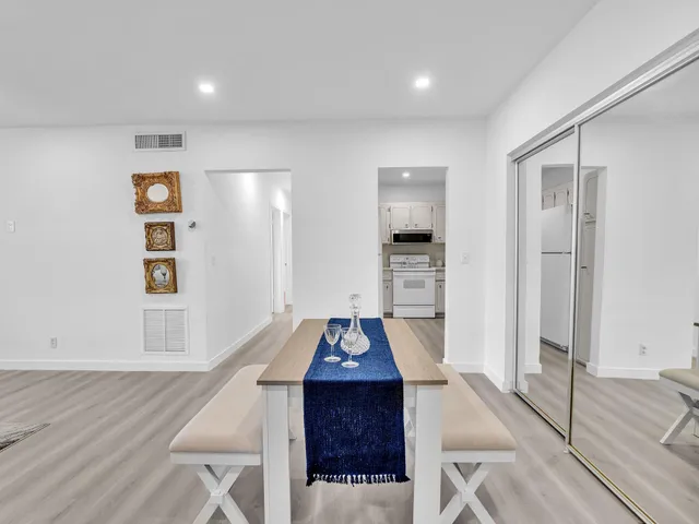 a view of a kitchen with a refrigerator and a refrigerator