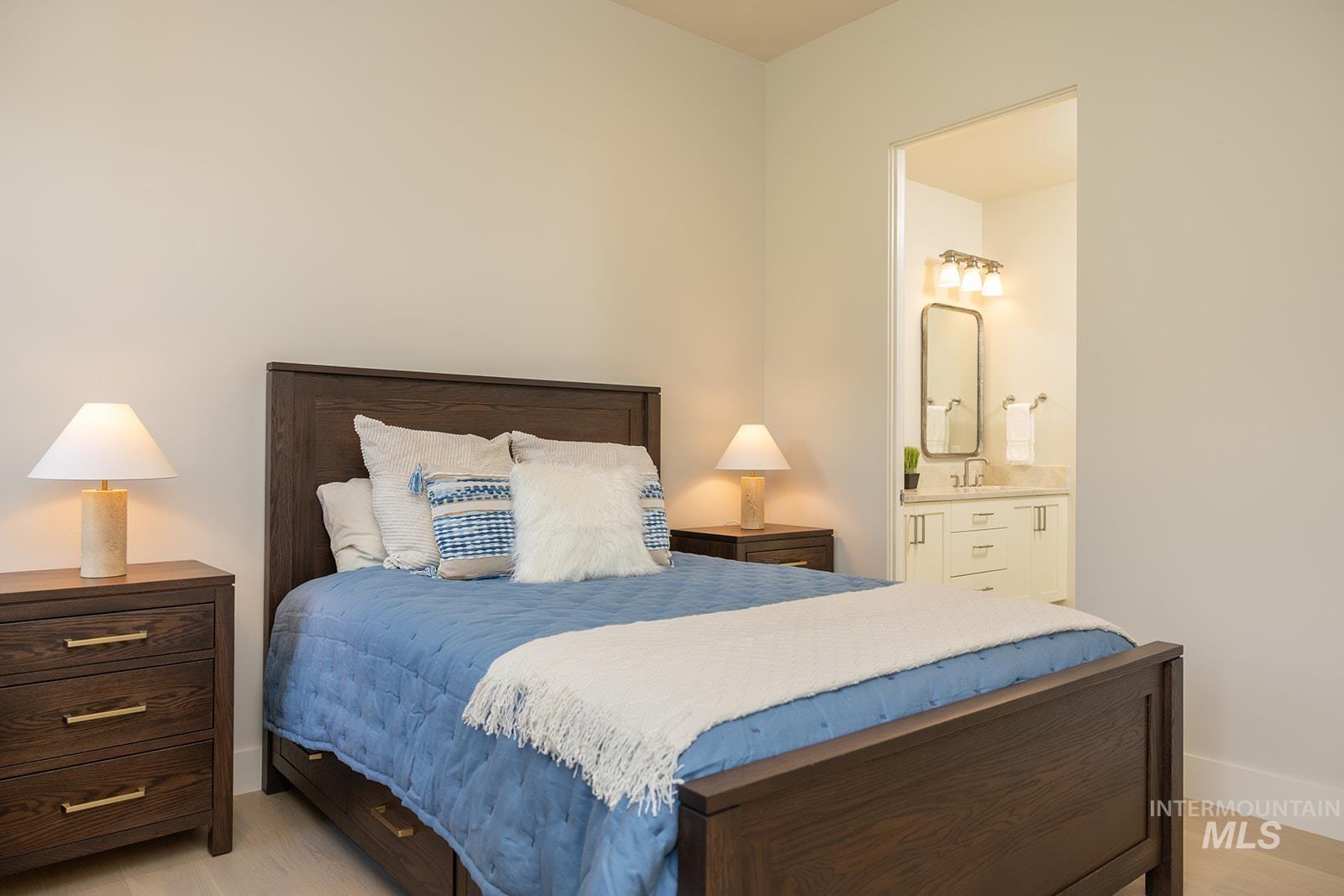 27 Streamside Drive Hailey, ID 83333 - Photo 21 of 39 Bedroom featuring ensuite bathroom and light wood-style flooring