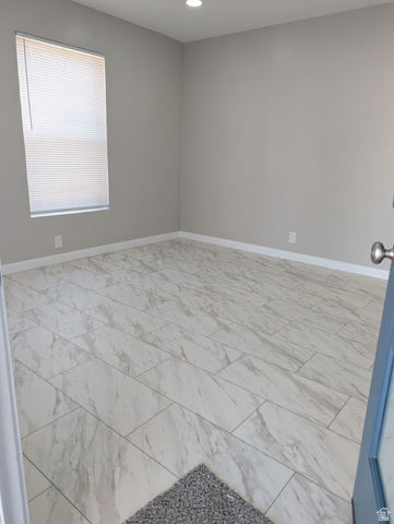 2880 Merton Way Magna, UT 84044 - Photo 28 of 30 Spacious room featuring large format tile flooring and neutral wall tones