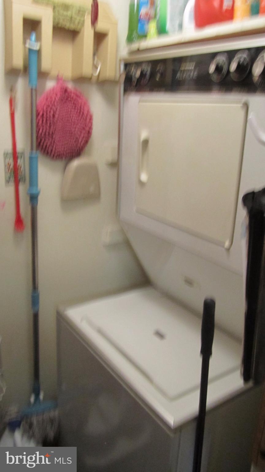 110 Cross Keys Road, Unit R110F Baltimore, MD 21210 - Photo 16 of 30 a utility room with dryer and washer