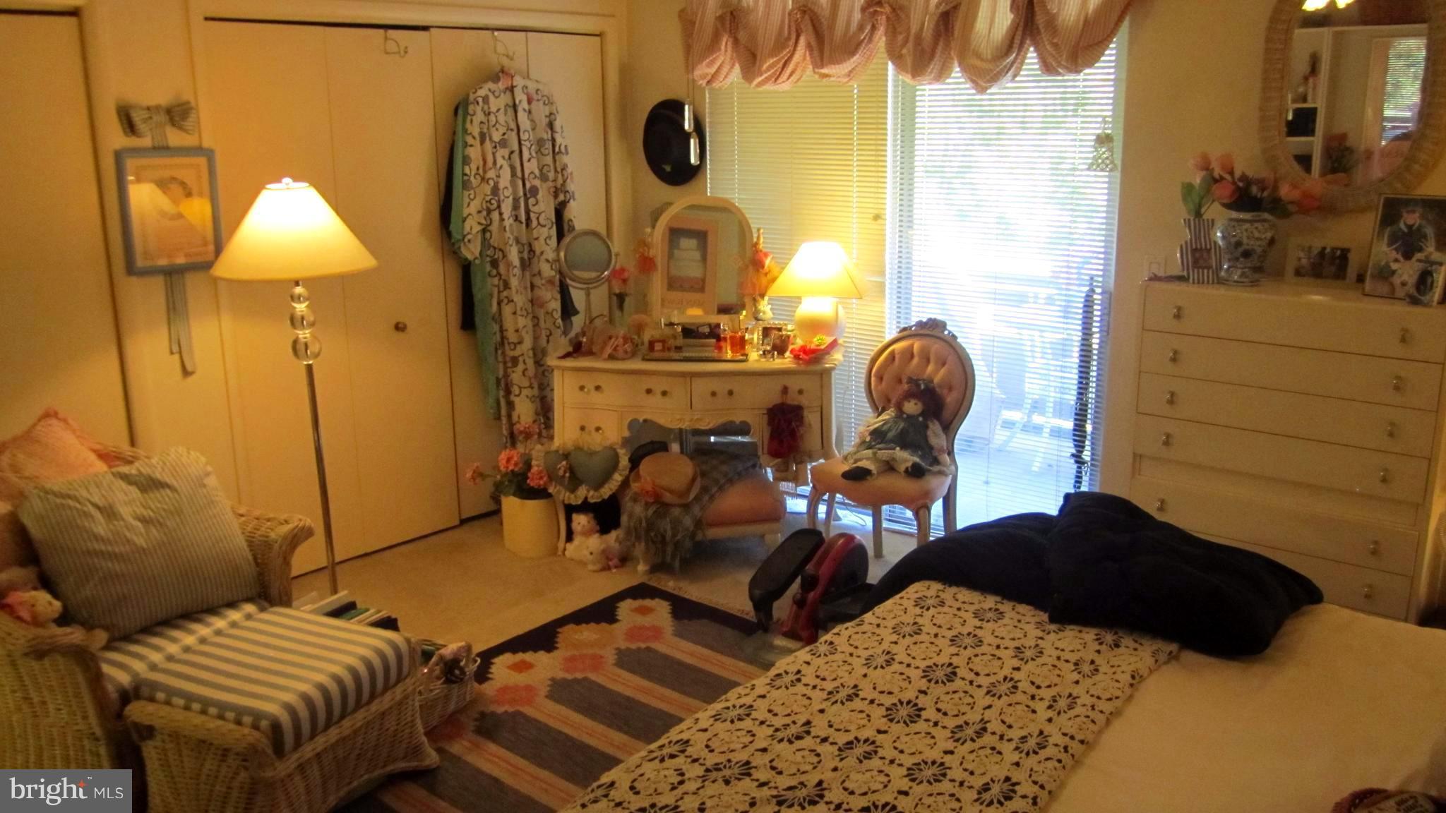 110 Cross Keys Road, Unit R110F Baltimore, MD 21210 - Photo 20 of 30 a living room with furniture and wooden floor