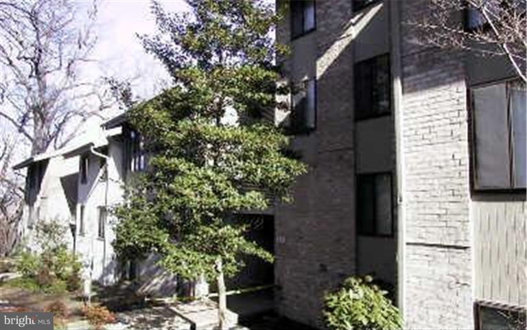 110 Cross Keys Road, Unit R110F Baltimore, MD 21210 - Photo 3 of 30 a brick building with a tree in front of it