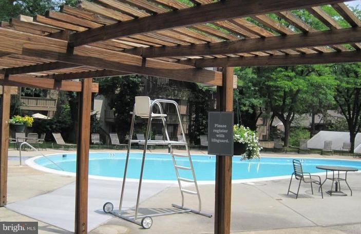 110 Cross Keys Road, Unit R110F Baltimore, MD 21210 - Photo 30 of 30 a patio with a patio table and chairs