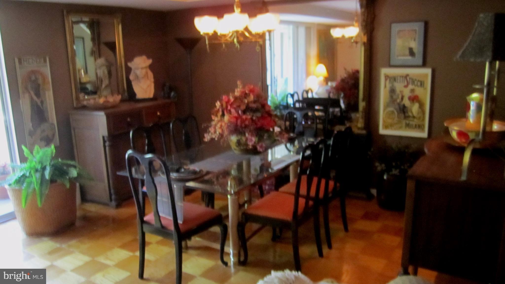 110 Cross Keys Road, Unit R110F Baltimore, MD 21210 - Photo 8 of 30 a view of a dining room with furniture