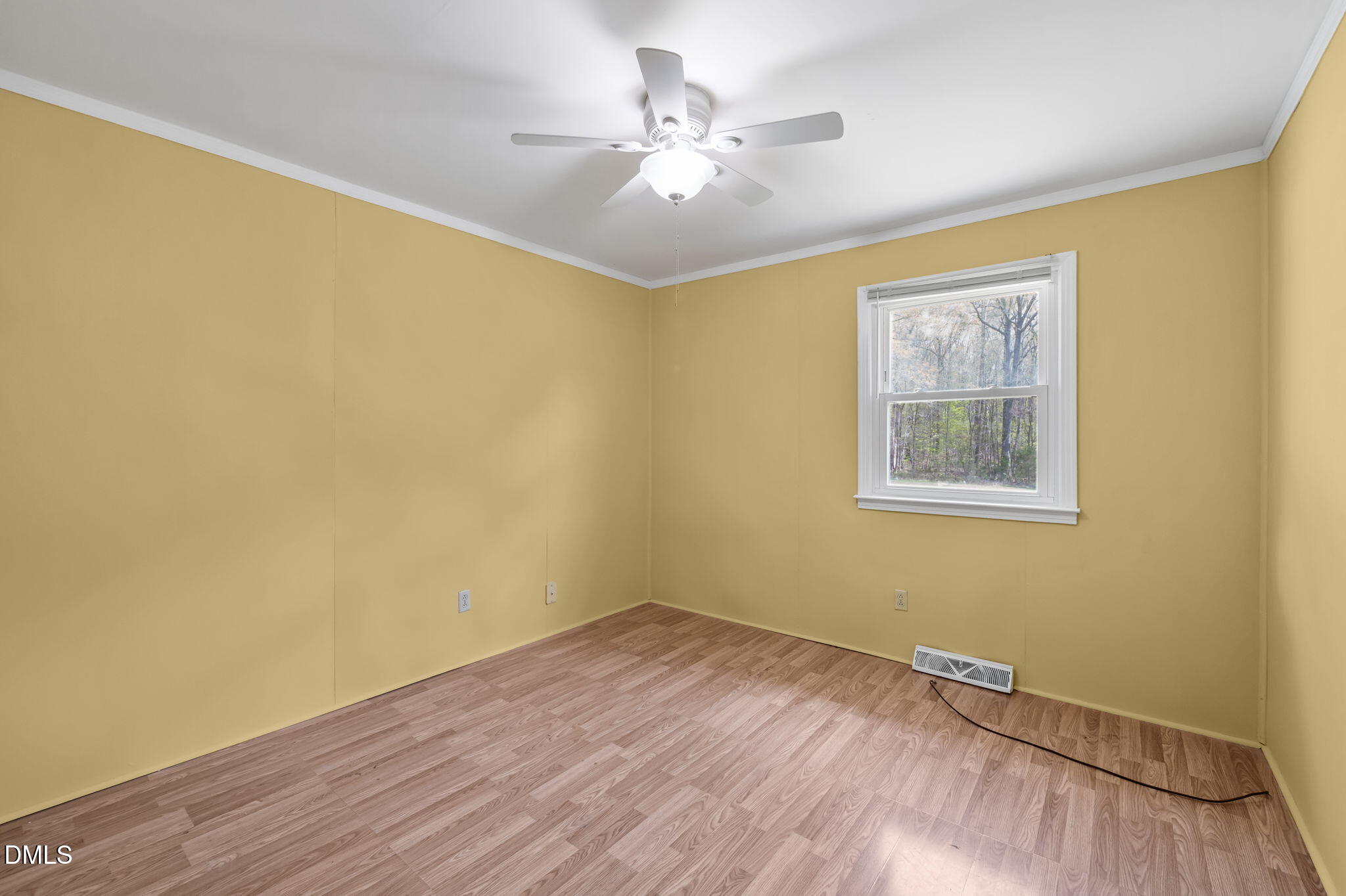 95 Harold Gill Road Roxboro, NC 27574 - Photo 19 of 53 a view of a room with wooden floor and a ceiling fan