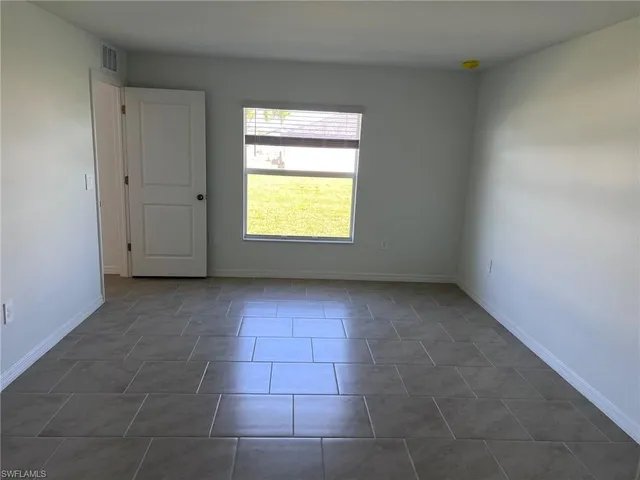 a kitchen with stainless steel appliances a refrigerator stove microwave and sink