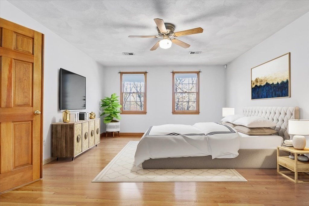 72 Jefferson Road Franklin, MA 02038 - Photo 17 of 33 a spacious bedroom with a bed and a chandelier