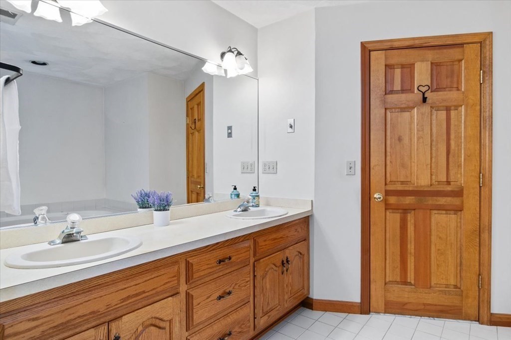 72 Jefferson Road Franklin, MA 02038 - Photo 18 of 33 a bathroom with a double vanity sink and a mirror