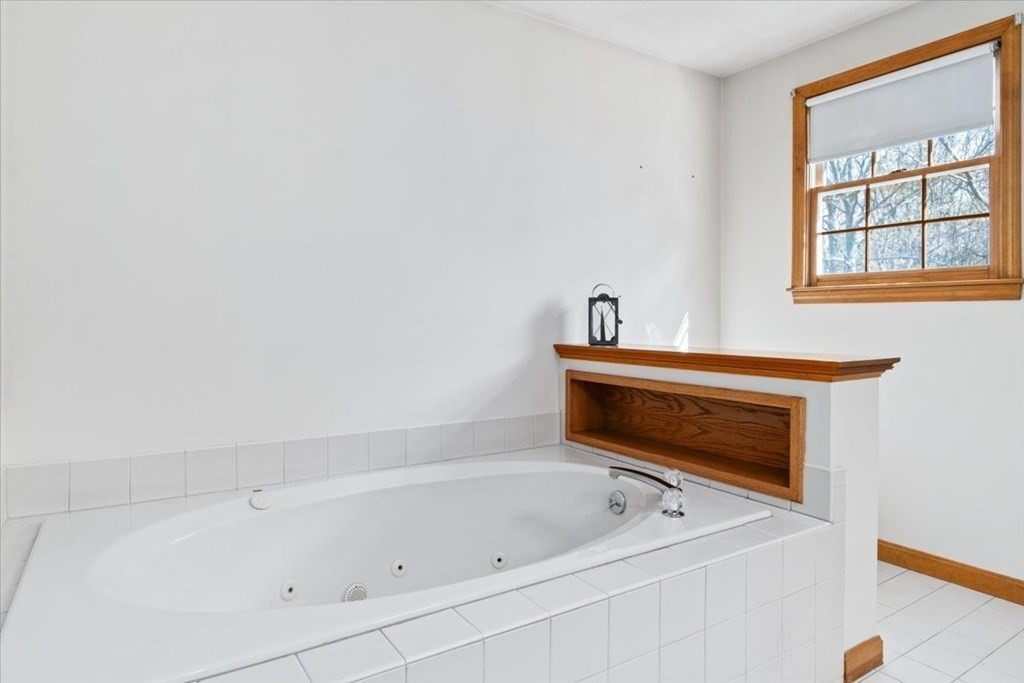 72 Jefferson Road Franklin, MA 02038 - Photo 19 of 33 a bathroom with a tub and a window