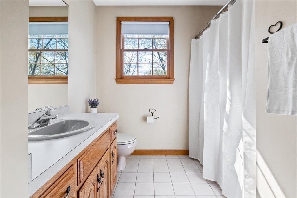 72 Jefferson Road Franklin, MA 02038 - Photo 22 of 33 a bathroom with a sink a toilet and a window