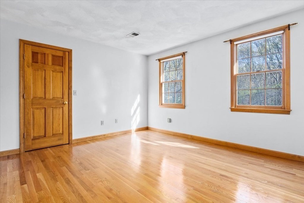 72 Jefferson Road Franklin, MA 02038 - Photo 24 of 33 a view of an empty room with wooden floor and a window