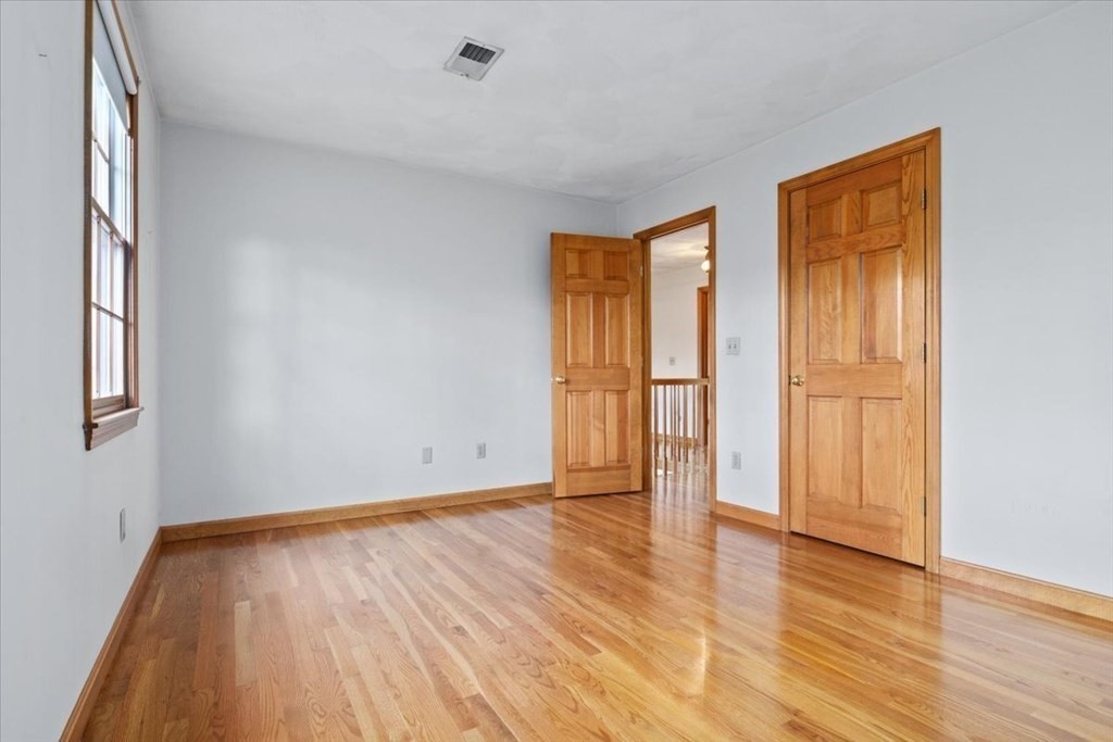 72 Jefferson Road Franklin, MA 02038 - Photo 25 of 33 a view of an empty room with wooden floor and a window