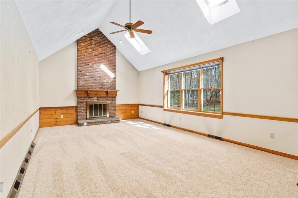 72 Jefferson Road Franklin, MA 02038 - Photo 6 of 33 an empty room with chandelier fan and windows