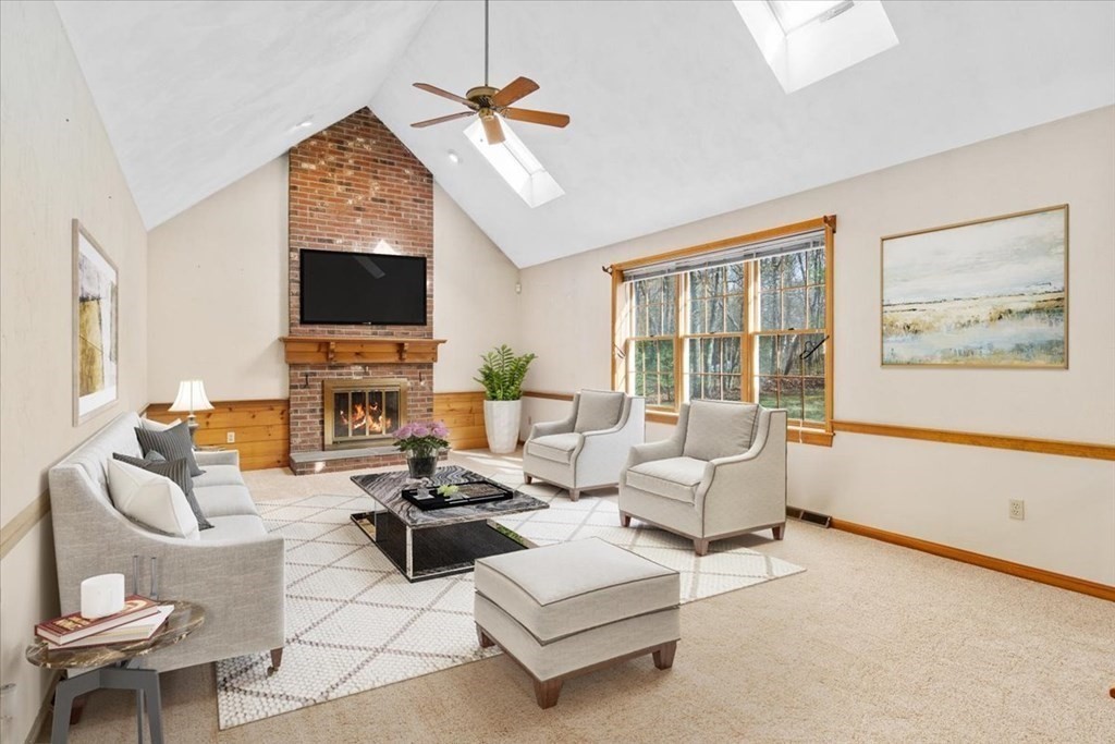 72 Jefferson Road Franklin, MA 02038 - Photo 7 of 33 a living room with furniture a fireplace and a flat screen tv