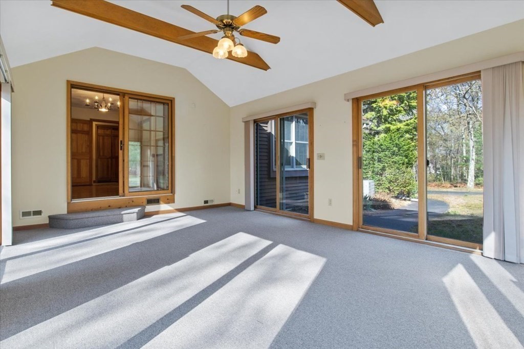 72 Jefferson Road Franklin, MA 02038 - Photo 9 of 33 a view of a livingroom with a chandelier fan and windows