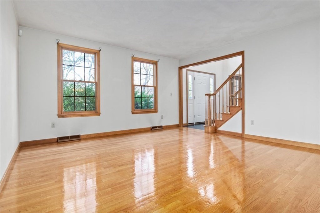 72 Jefferson Road Franklin, MA 02038 - Photo 10 of 33 a view of an empty room with wooden floor and a window