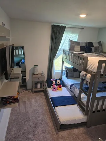 a room with furniture and a flat screen tv