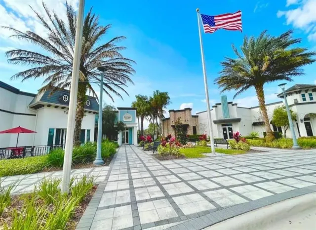 a view of multiple houses with a patio and a garden