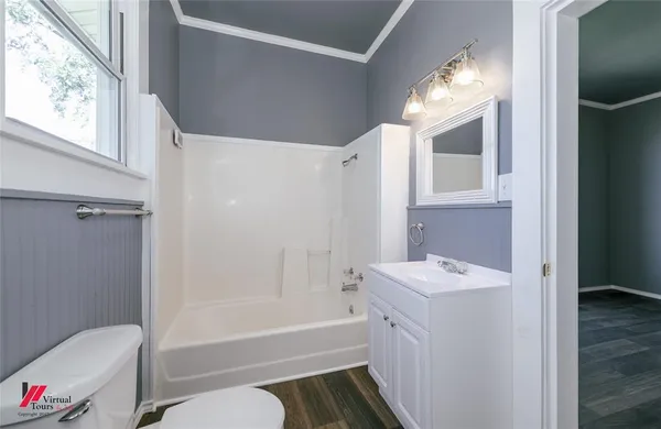 a bathroom with a sink a toilet and a bathtub