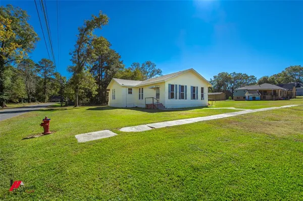 a view of a house with a big yard