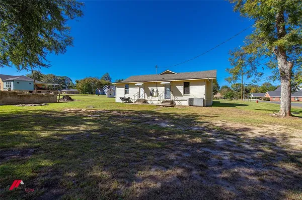 a view of a house with a big yard